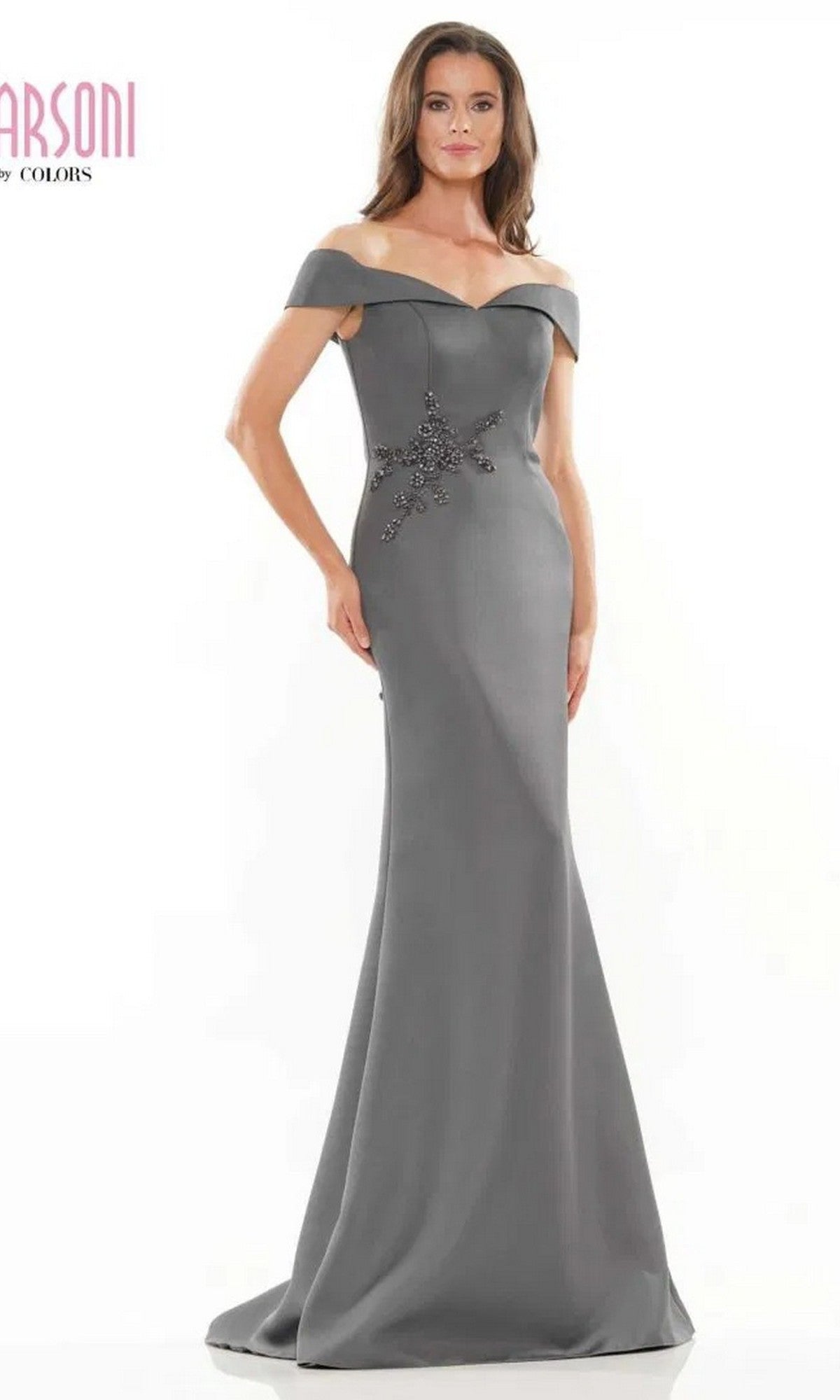 A woman poses gracefully against a plain white background, wearing the Long Formal Dress: Marsoni MV1003—an off-the-shoulder satin evening gown with beaded floral embellishment at the waist.